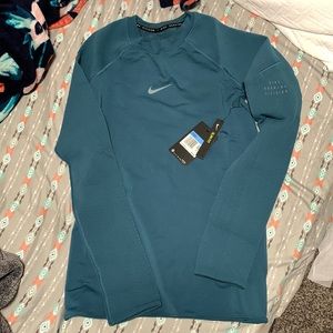 Nike running division long sleeve shirt. Teal color. Size medium. Brand new.